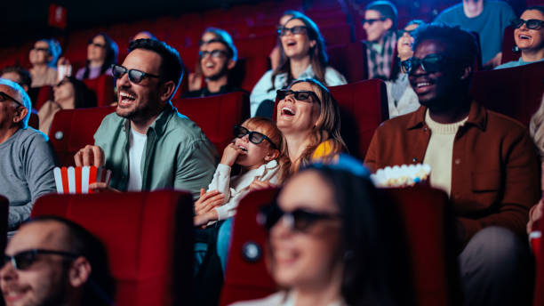 istock Audience laughing in 3D cinema. 1466383403