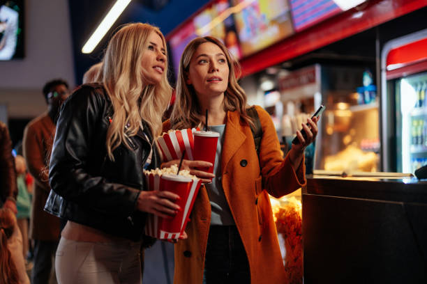istock Joyful girlfriends going to movies. 1466383467