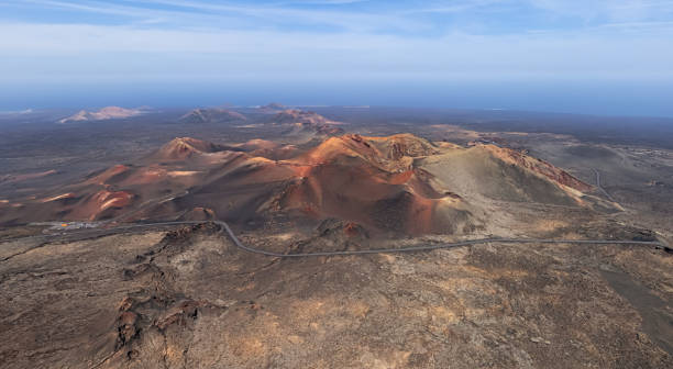 Aerial panorama of Volcanic valley near Timanfaya National Park, Lanzarote, Canary islands, Spain. Aerial view of volcanic valley near Timanfaya National Park, Lanzarote. dormant volcano stock pictures, royalty-free photos & images