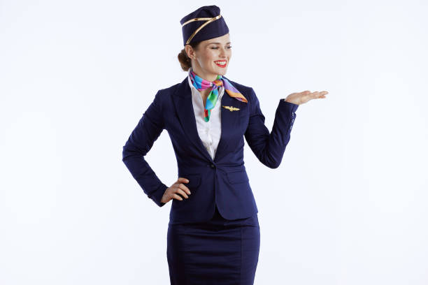happy stylish air hostess woman on presenting something stock photo