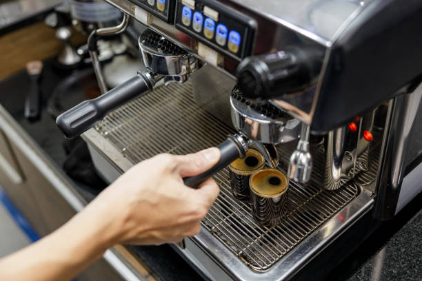 istock Barista make black coffee with coffee machine in cafe 1466392048