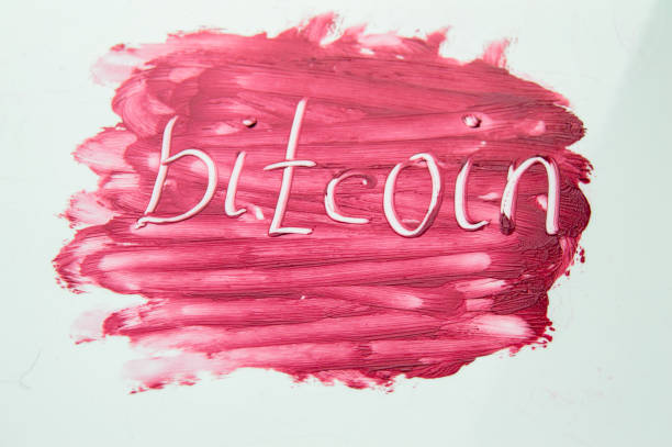 istock Cryptocurrency Bitcoin symbol on textured background red lipstick 1466403426