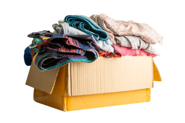 istock Donation box with used clothes isolated on white background with clipping path to support help for poor people in the world. 1466407715