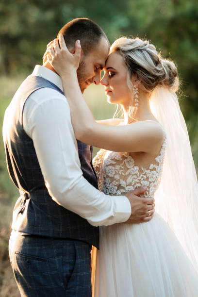 istock the groom and the bride are walking in the forest 1466411200