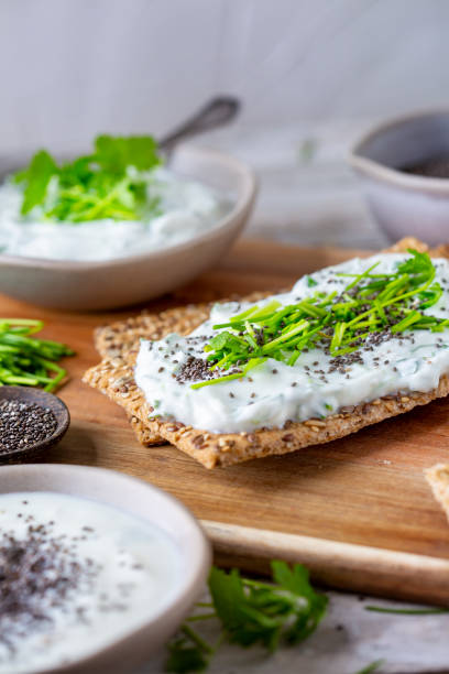 istock Crispbread, fresh curd, herbs and chia seeds 1466415694