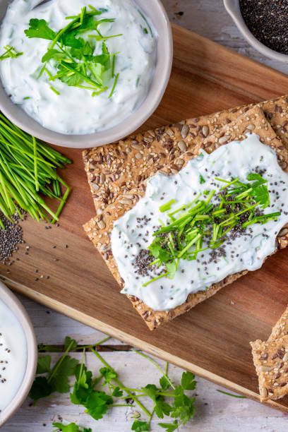 istock Crispbread, fresh curd, herbs and chia seeds 1466415737