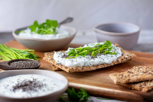 istock Crispbread, fresh curd, herbs and chia seeds 1466415774
