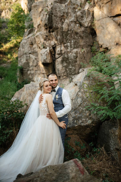 istock the groom and the bride are walking in the forest 1466416849