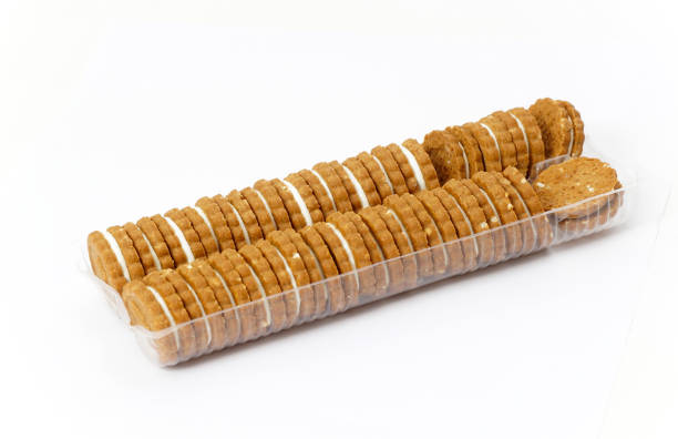 istock biscuit sandwich cookies, baked biscuits stuffed with milk cream in plastic packaging, 1466419352