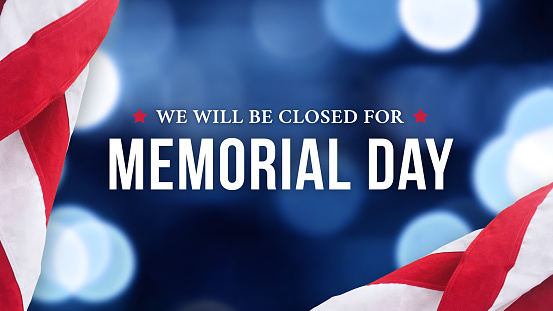 Memorial Day Closed Sign with American Flag Background and Abstract Blurred Bokeh Lights
