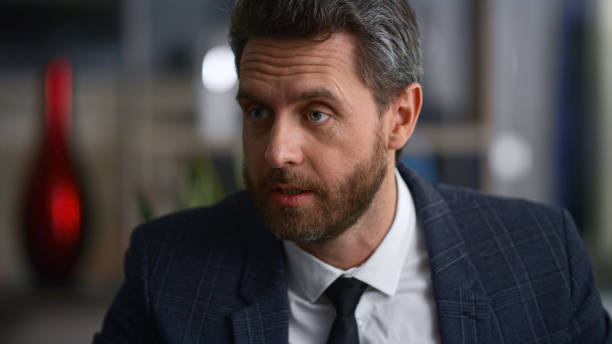 istock Confident businessman talking discussing work ideas in marketing company office. 1466420429