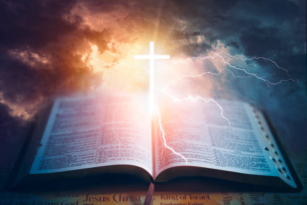 istock Dramatic Sky's Christian Cross and Holy Bible 1466420476