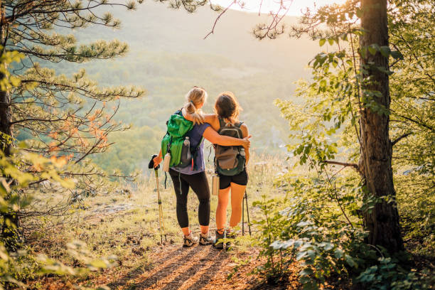 istock Mother and daughter hikers embracing each other 1466425938