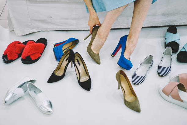 istock Woman trying on different elegant shoes 1466426454