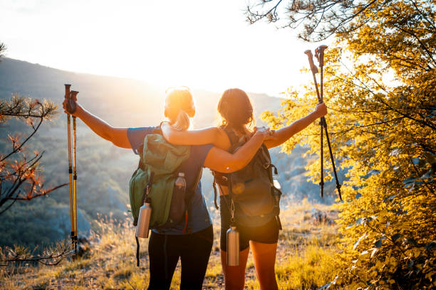 istock Mother and daughter hikers embracing each other 1466426484