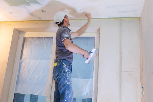 istock Worker make repairs in new apartment. Man plaster walls and ceilings 1466426529