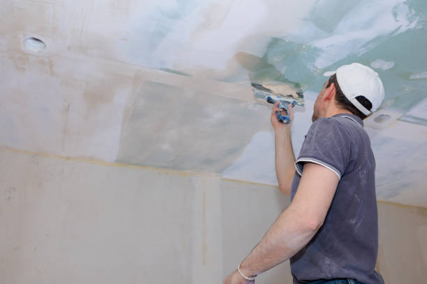 istock Worker make repairs in new apartment. Man plaster walls and ceilings 1466426659