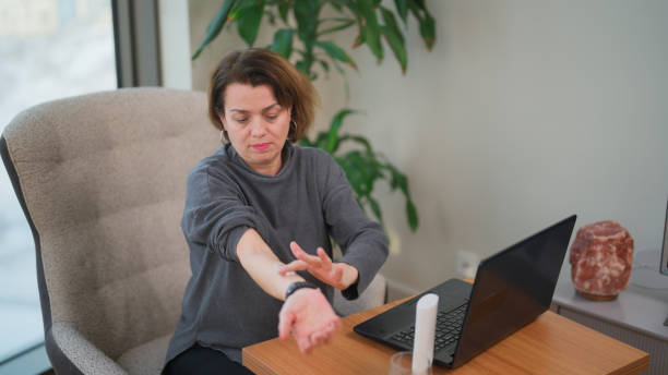 Woman applying hormone replacement therapy ointment on her arm