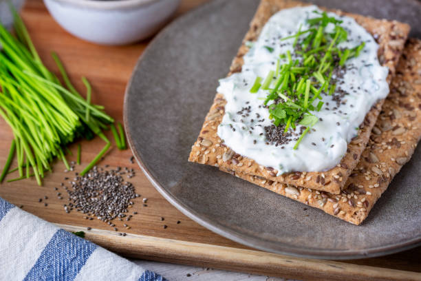 istock Crispbread, fresh curd, herbs and chia seeds 1466427171