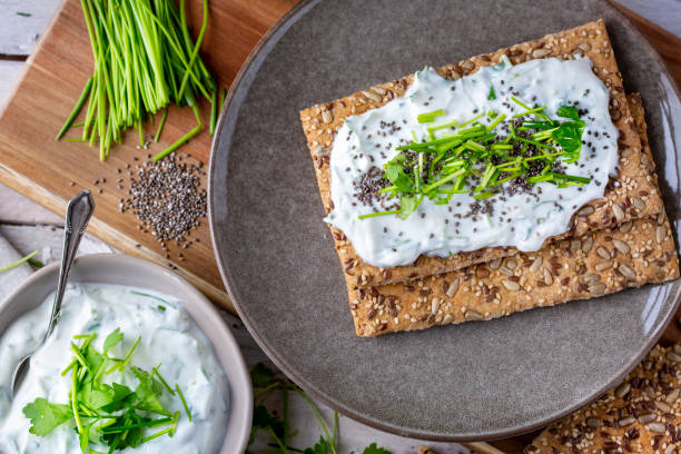 istock Crispbread, fresh curd, herbs and chia seeds 1466427239