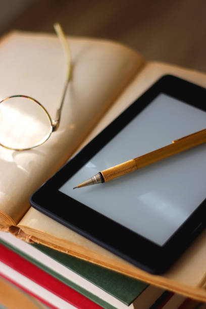 istock Books, Tablet, Glasses and Pen 1466428420
