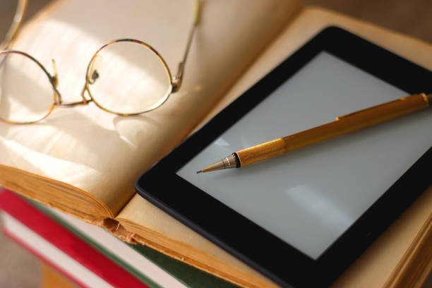 istock Books, Tablet, Glasses and Pen 1466428421