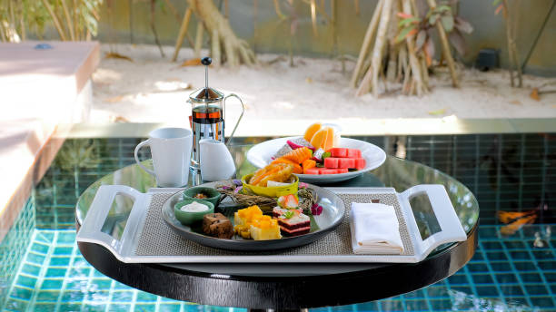 istock Luxe villa with swimming pool and tropical greenery, serving breakfast 1466429570