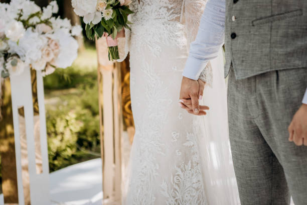 istock Bride and groom holding hands outdoors,  wedding theme 1466431146