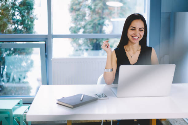 istock Smiling businesswoman working on laptop 1466431735