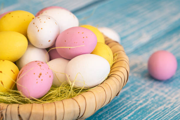 istock Easter candies, colorful chocolate eggs in a nest, close up. 1466435762
