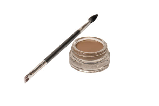 istock A brow pomade in blonde shade with brush isolated on a white background. 1466436614