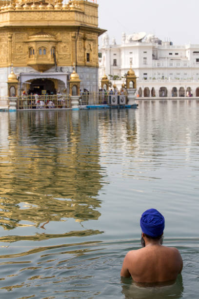 Golden Temple and Pool of Nectar, Amritsar, Punjab, India. The Punjab, is the state which is the heart of India’s Sikh community, bordering Pakistan. The city of Amritsar is best known for Harmandir Sahib, the holiest gurdwara, or Sikh place of worship and a major pilgrimage site. The distinctive Golden Temple, as it is known in English, is surrounded by the Pool of Nectar.
