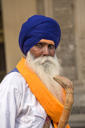 Amritsar, India - sep 26, 2014 : Unidentified Sikh man visiting the Golden Temple in Amritsar, Punjab, India. Sikh pilgrims travel from all over India to pray at this holy site.