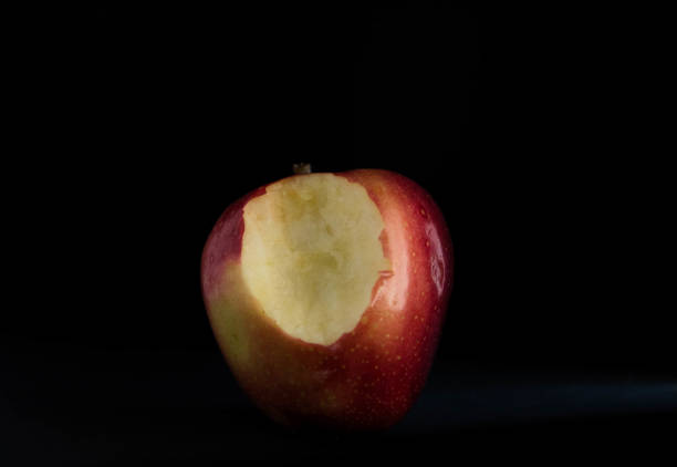 istock Healthy and tasty red apple in a darK background. Copy text. 1466440947