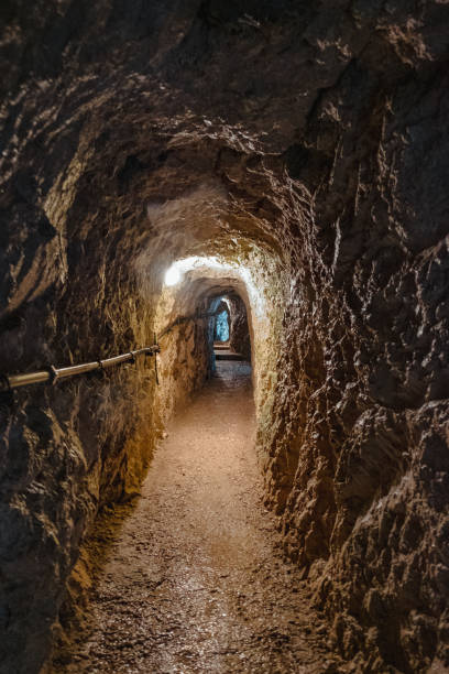 istock Tunnel while hiking through a gorge (Höllentalklamm) in Bavaria, Germany on an overcast day with light rain, green nature and steep rock faces. The water rushes powerfully down the mountain. 1466443467