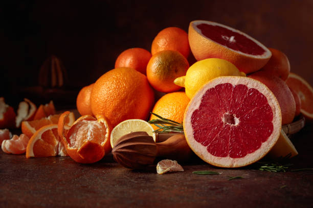 Citrus fruits on a old brown table.