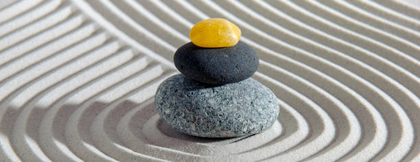 istock Japanese zen garden with stone in textured sand 1466448080