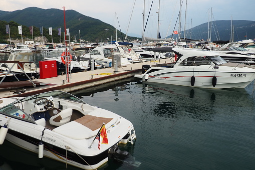 Meljine, Herceg Novi, Montenegro, August 13 2022 Boats, yachts and ships are at anchor. Moored ships in the parking lot. Adriatic Sea Mediterranean. Travel business. Sea travel and sports. Summertime
