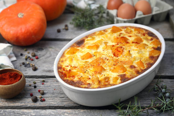 istock French cuisine. Vegetable pumpkin clafoutis in ceramic bakeware, smoked paprika dressing 1466452492