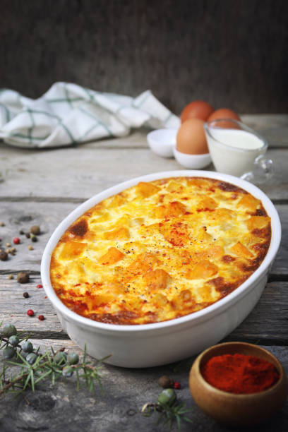 istock French cuisine. Vegetable pumpkin clafoutis in ceramic bakeware, eggs and cream 1466452536