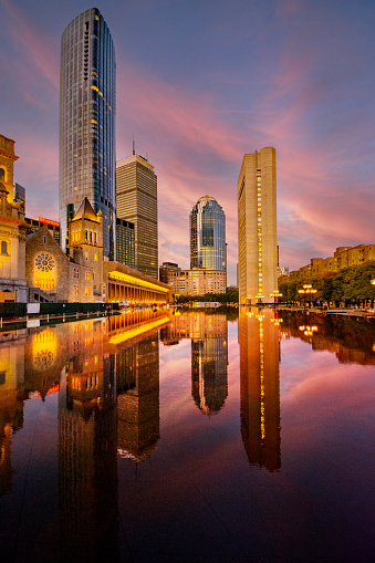 Boston skyline - Back Bay towers and the colorful sky are reflecting in the pool at Christian Science Plaza. Photo was taken in the early evening during the golden hour.