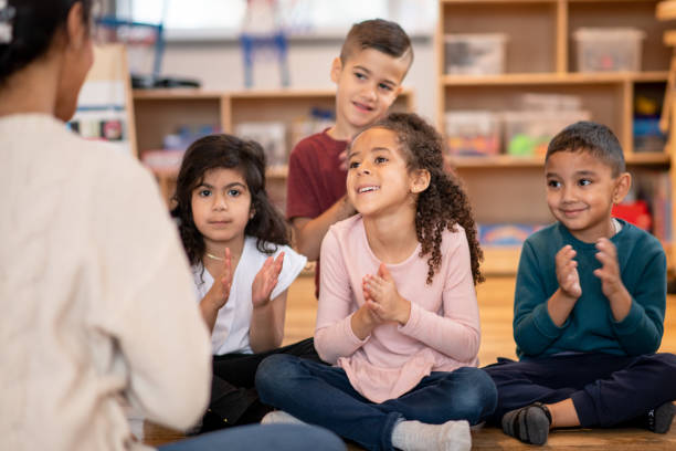 istock Kids clapping at daycare 1466457354