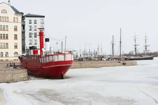 Red ship at iced Helsinki harbour. Finland