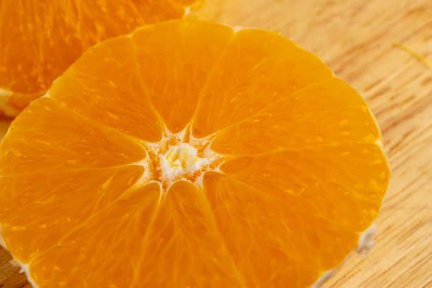 Peeled orange orange cut into pieces , peeling ripe and juicy orange