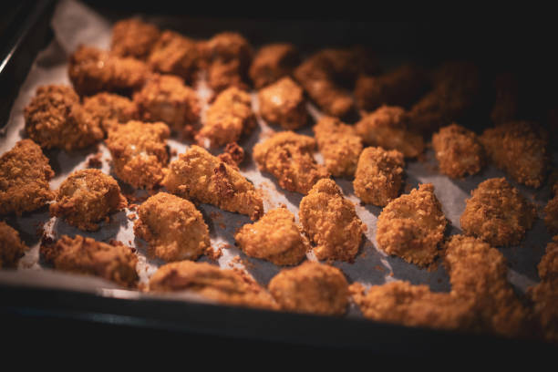 Chicken nuggets are baked in the oven
