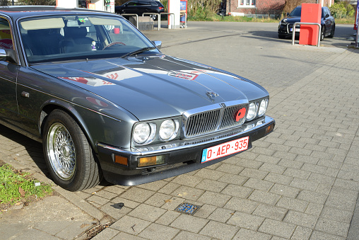 Leuven, Vlaams-Brabant, Belgium -  February 15, 2023: Oldtimer gray metallic Jaguar car