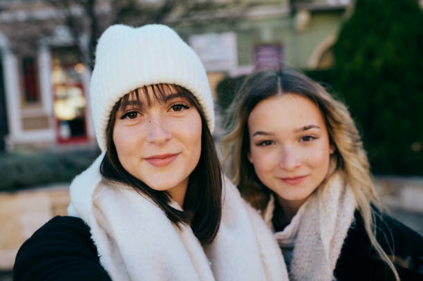 Portrait of two young women in a winter park