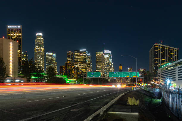 A picture of Downtown Los Angeles and the Harbor Freeway's traffic lights at night.