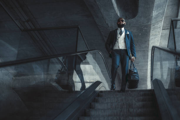 Black man descending a moving stair