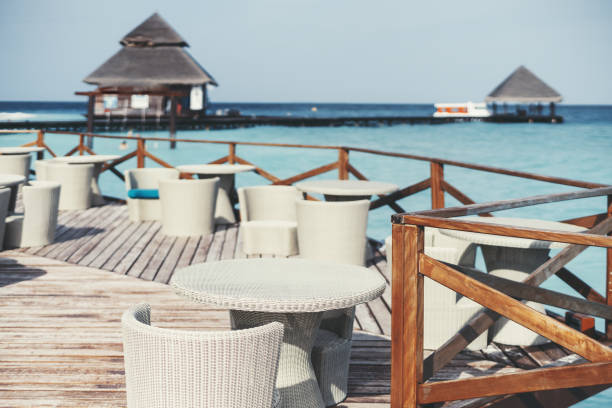 istock Relaxing dining patio by the sea 1466477566